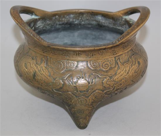 A Chinese bronze tripod censer, Xuande two character mark, 19th century, diam. 18cm, weight 2780g., old repair to base